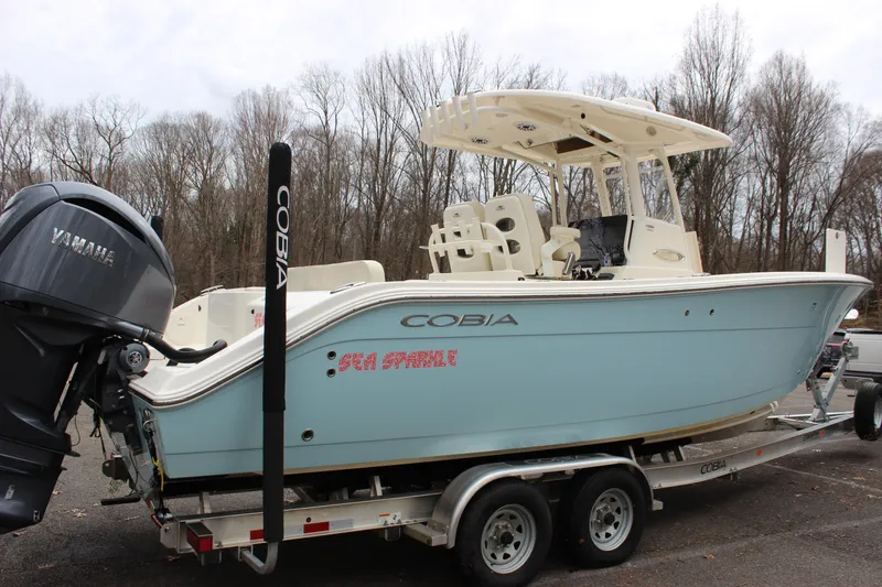 Slide: The Image of 2022 Cobia 280 Center Console boat on trailer with Yamaha engine. - 3