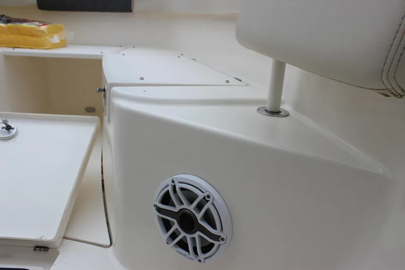Slide: The Image of 2022 Cobia 280 Center Console boat interior with speaker and seating area. - 35