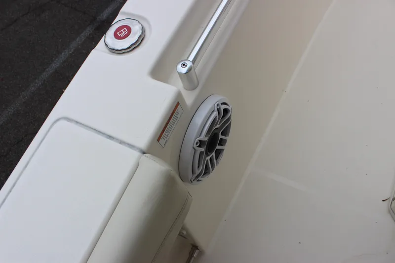 Slide: The Image of 2022 Cobia 280 Center Console boat interior with speaker and fuel cap. - 56