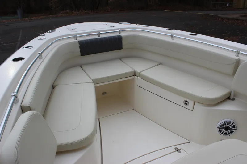 Slide: The Image of 2022 Cobia 280 Center Console boat with spacious seating area and sleek design. - 69