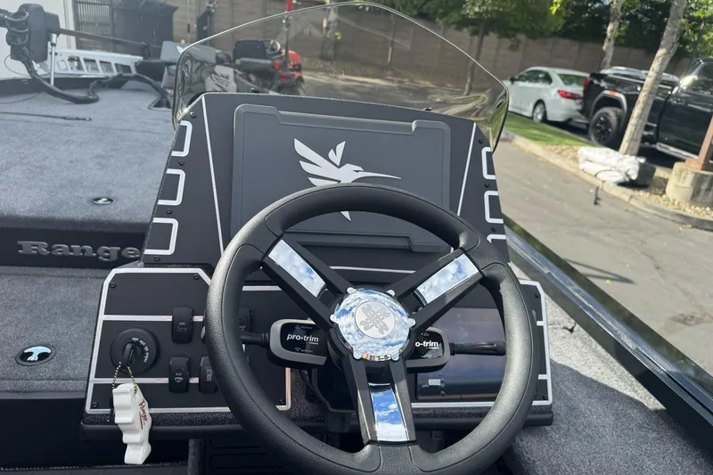 Slide: The Image of Steering console of 2026 Ranger ALPHA 208 boat, featuring modern controls and sleek design. - 86