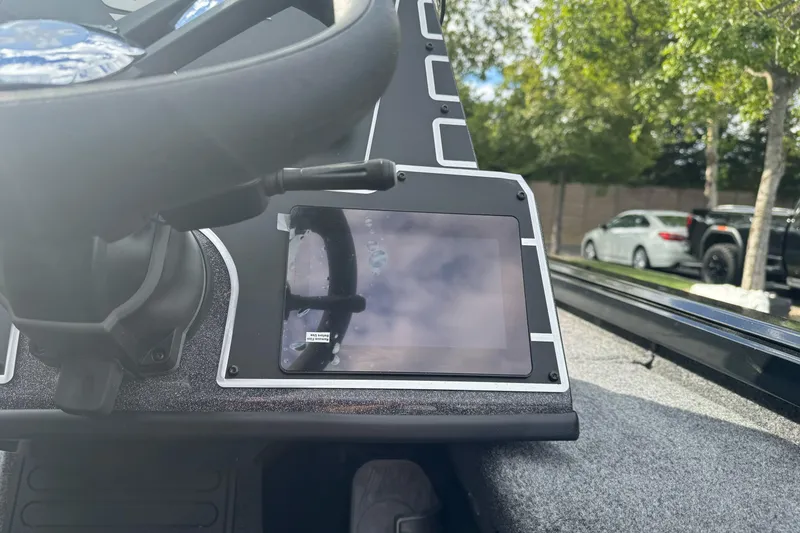 Slide: The Image of Steering wheel and dashboard of 2026 Ranger ALPHA 208 boat, featuring a digital display. - 90