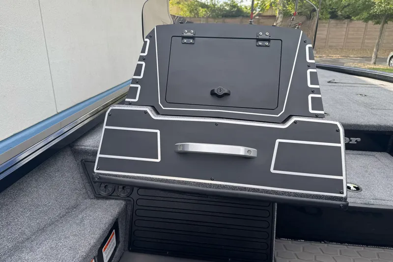 Slide: The Image of 2026 Ranger ALPHA 208 boat console with sleek black design and modern features. - 91