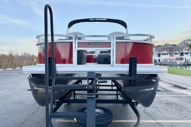 Slide: The Image of 2026 Sun Tracker Bass Buggy 16 XL Select pontoon boat on trailer, rear view. - 104