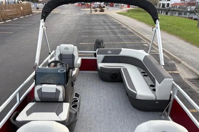 Slide: The Image of 2026 Sun Tracker Bass Buggy 16 XL Select pontoon boat with spacious seating and modern design. - 105