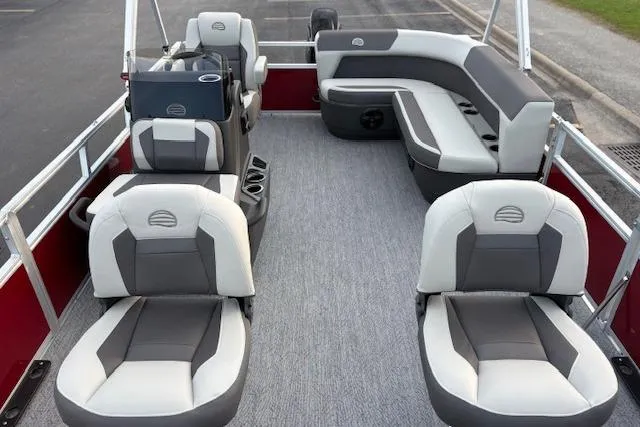 Slide: The Image of 2026 Sun Tracker Bass Buggy 16 XL Select pontoon boat interior with gray and white seating. - 106