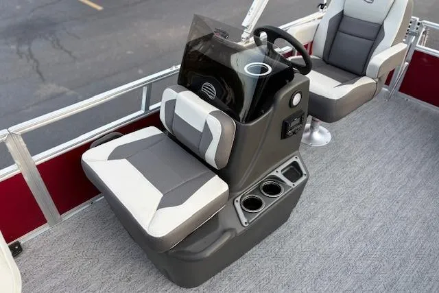 Slide: The Image of 2026 Sun Tracker Bass Buggy 16 XL Select boat interior with steering console and seating. - 107