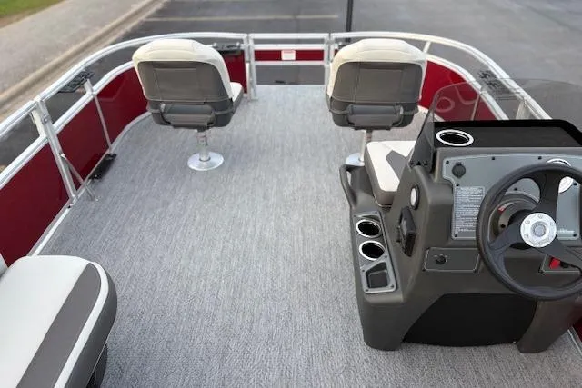 Slide: The Image of 2026 Sun Tracker Bass Buggy 16 XL Select pontoon boat interior with seating and steering console. - 111