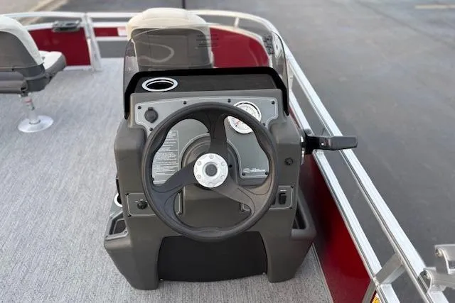 Slide: The Image of 2026 Sun Tracker Bass Buggy 16 XL Select steering console with modern controls and seating. - 94