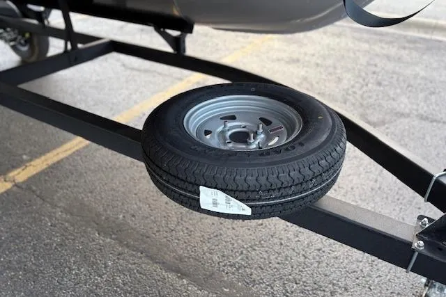 Slide: The Image of Spare tire mounted on a Sun Tracker Bass Buggy 16 XL Select trailer, 2026 model. - 95