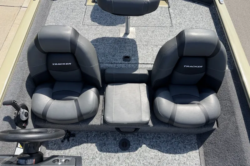 Slide: The Image of 2026 Tracker Pro Team 175 boat interior with two cushioned seats and steering wheel. - 17