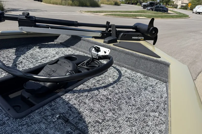 Slide: The Image of 2026 Tracker Pro Team 175 boat with Minn Kota trolling motor on deck. - 13