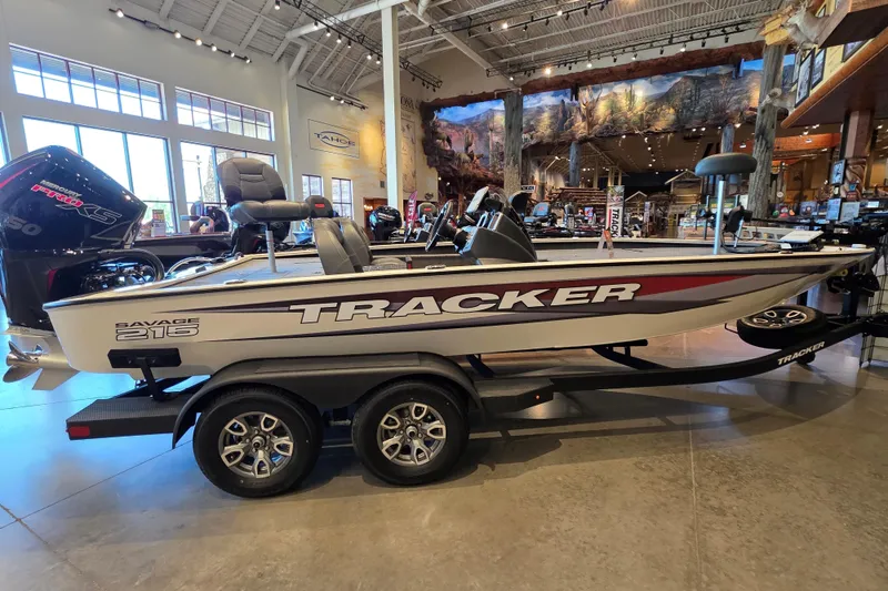 The Image of 2026 Tracker Savage 215 boat displayed indoors on a trailer. - 0