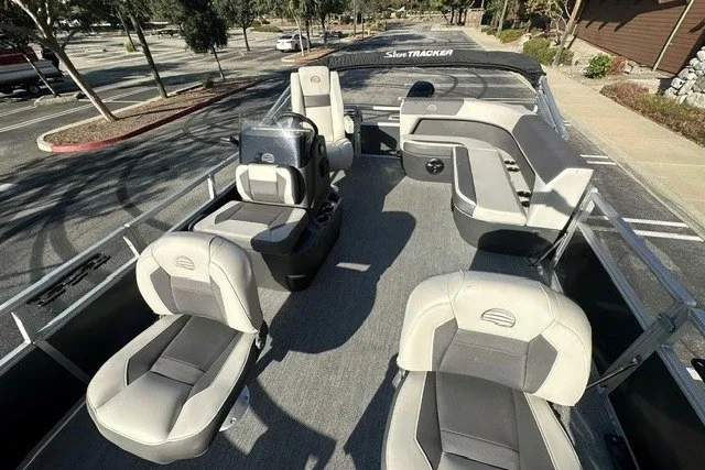 Slide: The Image of 2026 Sun Tracker Bass Buggy 16 XL Select pontoon boat with spacious seating and modern design. - 16