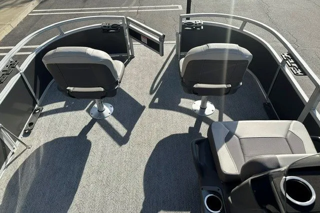 Slide: The Image of 2026 Sun Tracker Bass Buggy 16 XL Select pontoon boat interior with seating and steering console. - 15