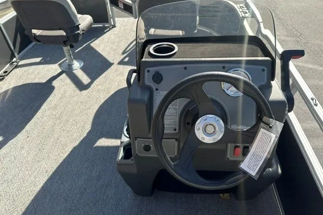 Slide: The Image of 2026 Sun Tracker Bass Buggy 16 XL Select boat steering console with seating. - 14