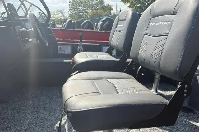 Slide: The Image of 2026 Tracker Pro Guide V-16 WT boat interior with comfortable seating and modern design. - 51