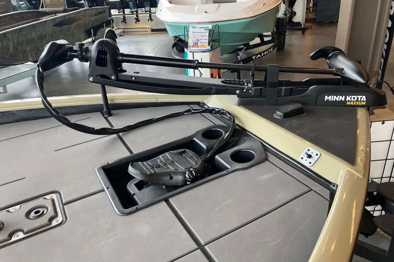 Slide: The Image of 2026 Tracker Savage 215 boat with Minn Kota Maxxum trolling motor in showroom. - 7