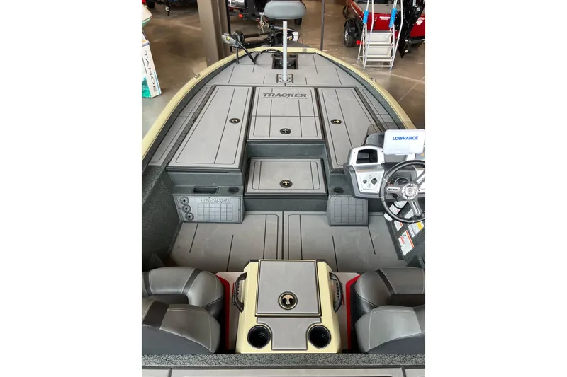 Slide: The Image of 2026 Tracker Savage 215 boat interior with steering wheel and storage compartments. - 11