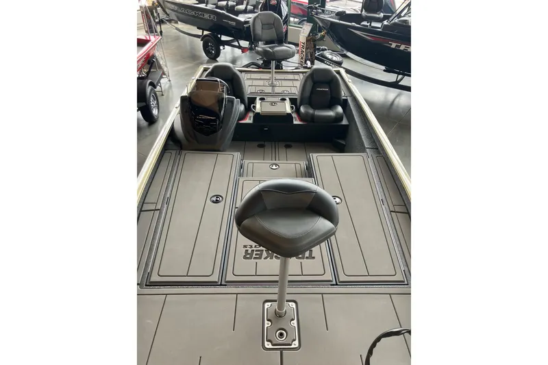 Slide: The Image of 2026 Tracker Savage 215 boat interior with seating and storage compartments. - 10