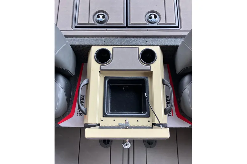 Slide: The Image of Interior of 2026 Tracker Savage 215 boat with cup holders and storage compartment. - 8
