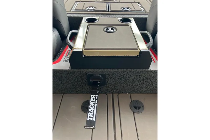 Slide: The Image of 2026 Tracker Savage 215 boat interior with cup holders and storage compartments. - 9
