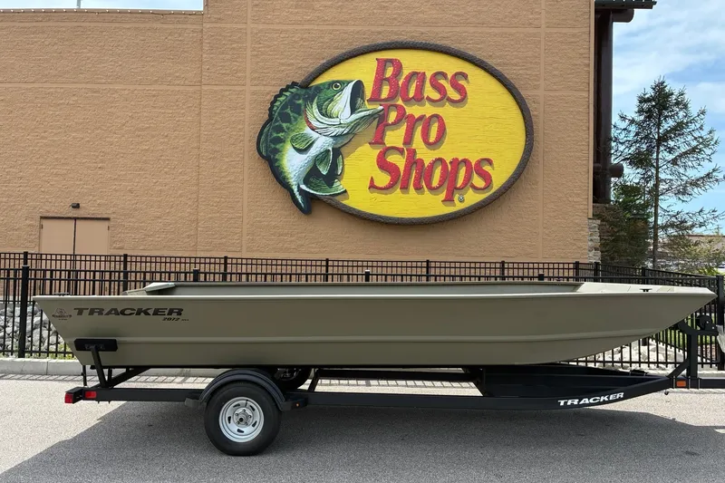 The Image of 2026 Tracker Grizzly 2072 Utility boat displayed outside Bass Pro Shops. - 0