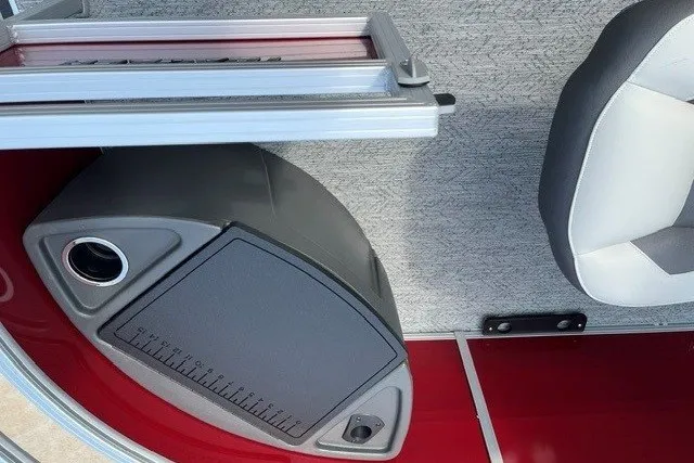 Slide: The Image of Interior of 2026 Sun Tracker Fishin' Barge 22 DLX with seating and storage compartment. - 19