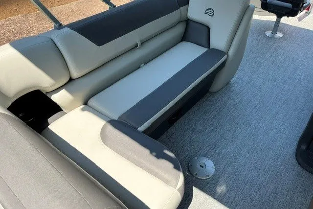 Slide: The Image of 2026 Sun Tracker Fishin' Barge 22 DLX interior seating with gray upholstery. - 113