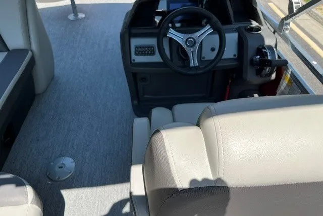 Slide: The Image of Interior view of 2026 Sun Tracker Fishin' Barge 22 DLX with steering console and seating. - 112