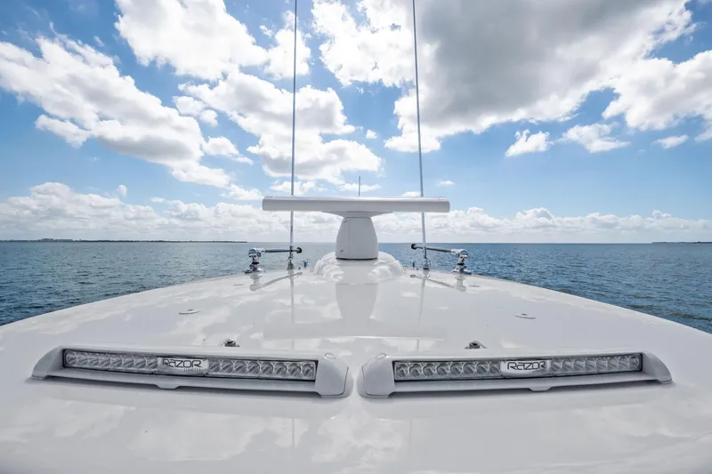 Slide: The Image of 2026 Valhalla Boatworks V-37 on open water under a partly cloudy sky. - 17