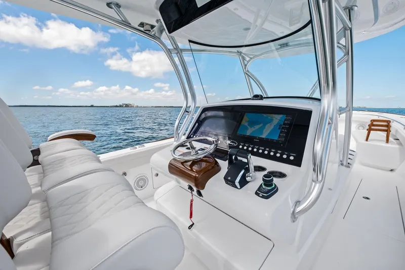 Slide: The Image of 2026 Valhalla Boatworks V-37 helm with advanced navigation system on open water. - 22