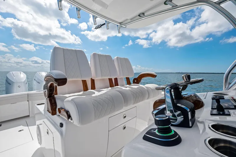 Slide: The Image of 2026 Valhalla Boatworks V-37 helm with luxurious seating and advanced controls on open water. - 24