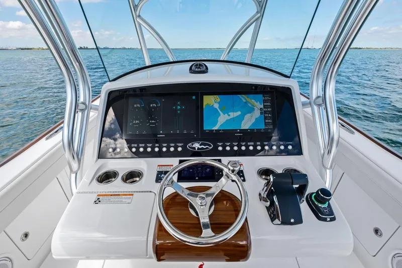 Slide: The Image of Helm of 2026 Valhalla Boatworks V-37 with advanced navigation system on open water. - 25