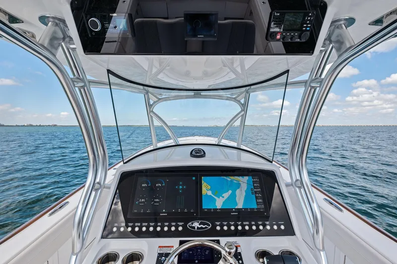 Slide: The Image of 2026 Valhalla Boatworks V-37 helm with advanced navigation system on open water. - 29