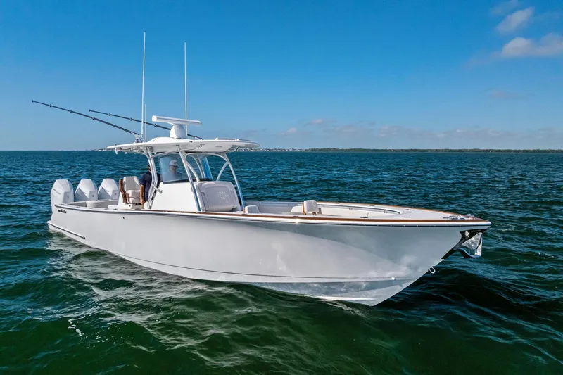 Slide: The Image of 2026 Valhalla Boatworks V-37 cruising on open water under clear blue skies. - 3