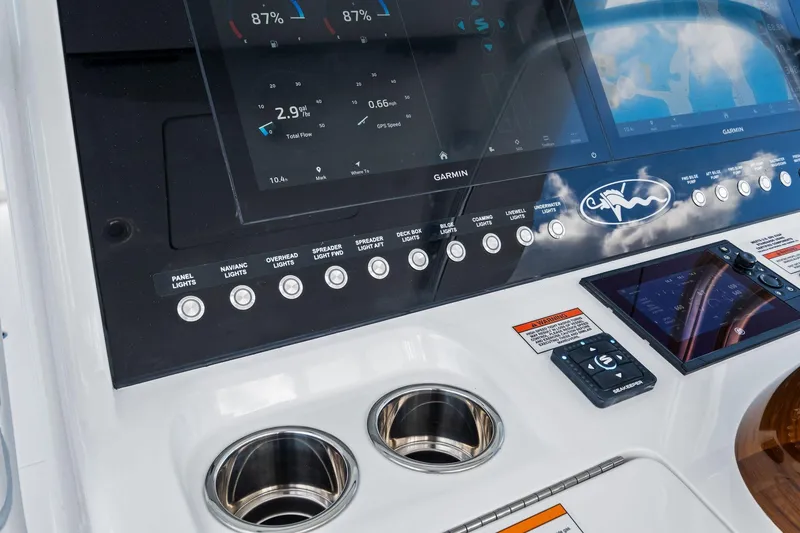 Slide: The Image of 2026 Valhalla Boatworks V-37 dashboard with Garmin displays and control panel. - 31