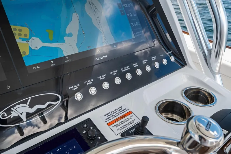 Slide: The Image of 2026 Valhalla Boatworks V-37 helm with Garmin navigation display and control panel. - 32