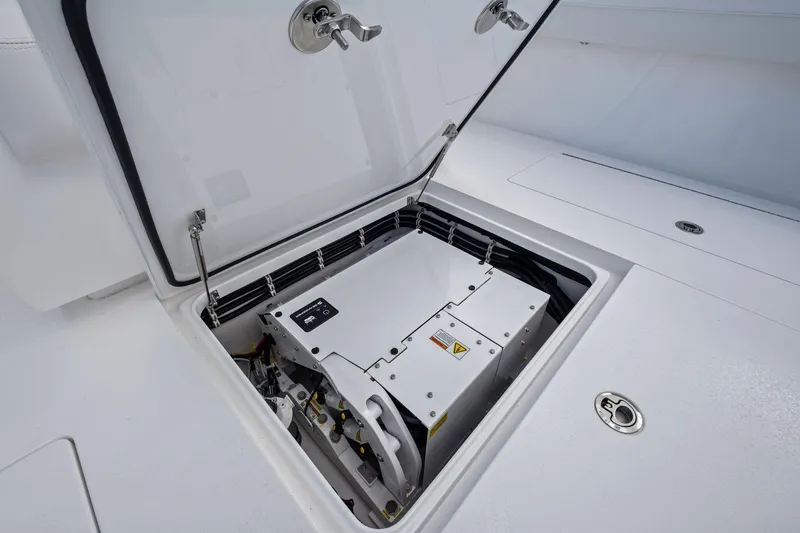 Slide: The Image of 2026 Valhalla Boatworks V-37 electrical compartment with open hatch, showcasing internal components. - 37