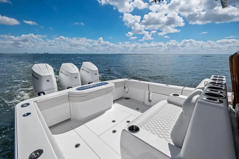 Slide: The Image of 2026 Valhalla Boatworks V-37 with Mercury engines, cruising on open water under a blue sky. - 38