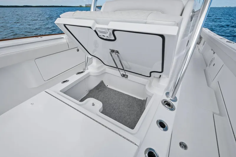 Slide: The Image of 2026 Valhalla Boatworks V-37 open storage compartment on deck, ocean in background. - 4