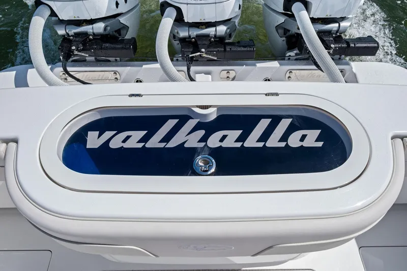 Slide: The Image of 2026 Valhalla Boatworks V-37 with triple outboard engines and branded livewell. - 40