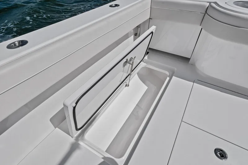 Slide: The Image of 2026 Valhalla Boatworks V-37 deck with open storage compartment, showcasing sleek design. - 41