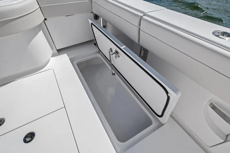 Slide: The Image of 2026 Valhalla Boatworks V-37 open storage compartment on deck, showcasing sleek design. - 42