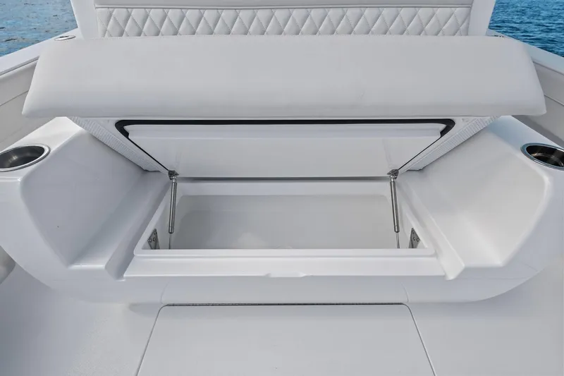 Slide: The Image of 2026 Valhalla Boatworks V-37 storage compartment with open lid, showcasing spacious interior. - 44