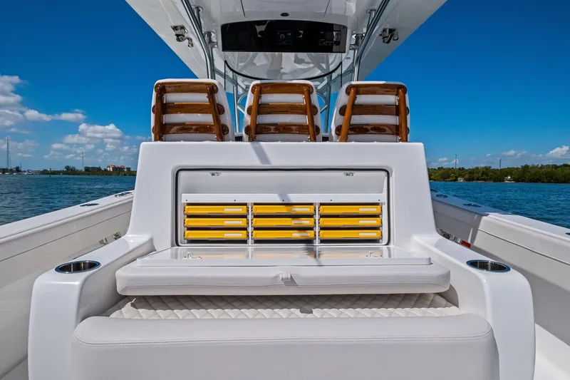 Slide: The Image of 2026 Valhalla Boatworks V-37 interior with seating and storage, on a sunny day. - 49