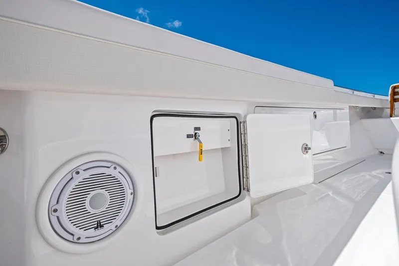 Slide: The Image of 2026 Valhalla Boatworks V-37 deck with storage compartments and speaker. - 54