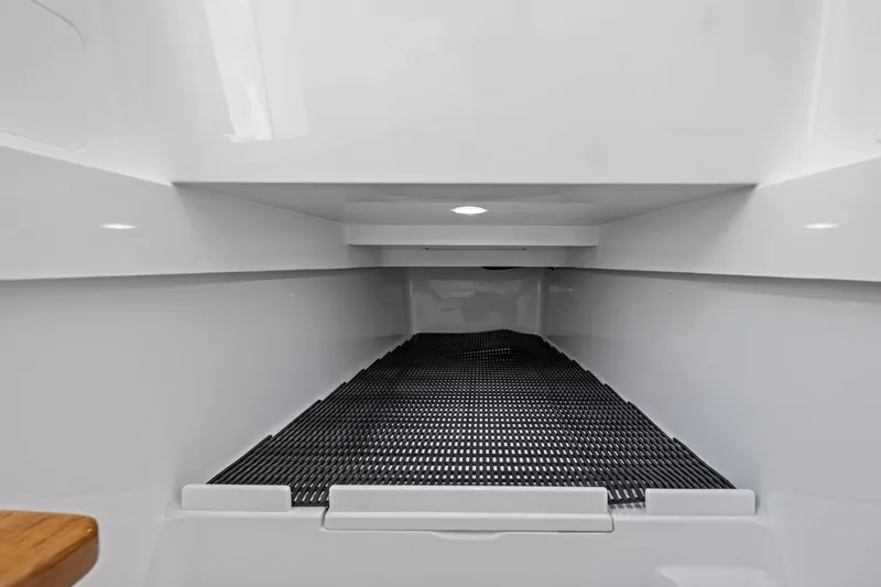 Slide: The Image of Interior storage compartment of 2026 Valhalla Boatworks V-37, featuring sleek design and ample space. - 55