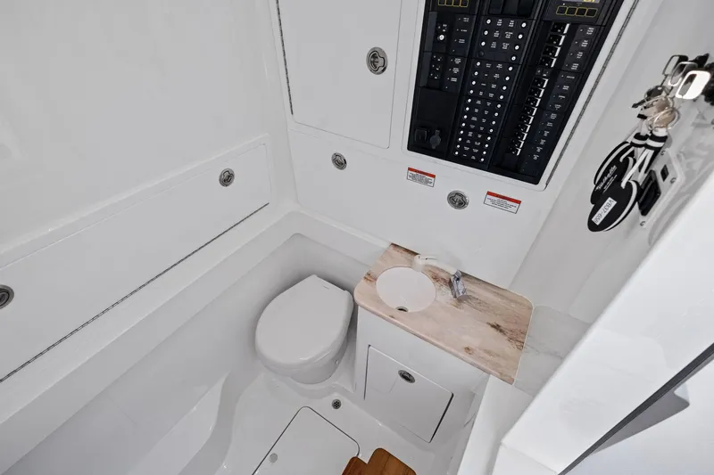 Slide: The Image of 2026 Valhalla Boatworks V-37 interior with compact bathroom and control panel. - 59