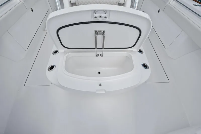 Slide: The Image of 2026 Valhalla Boatworks V-37 interior storage compartment, open and spacious design. - 6